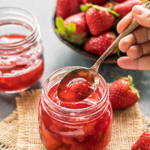 homemade strawberry syrup in a mason jar