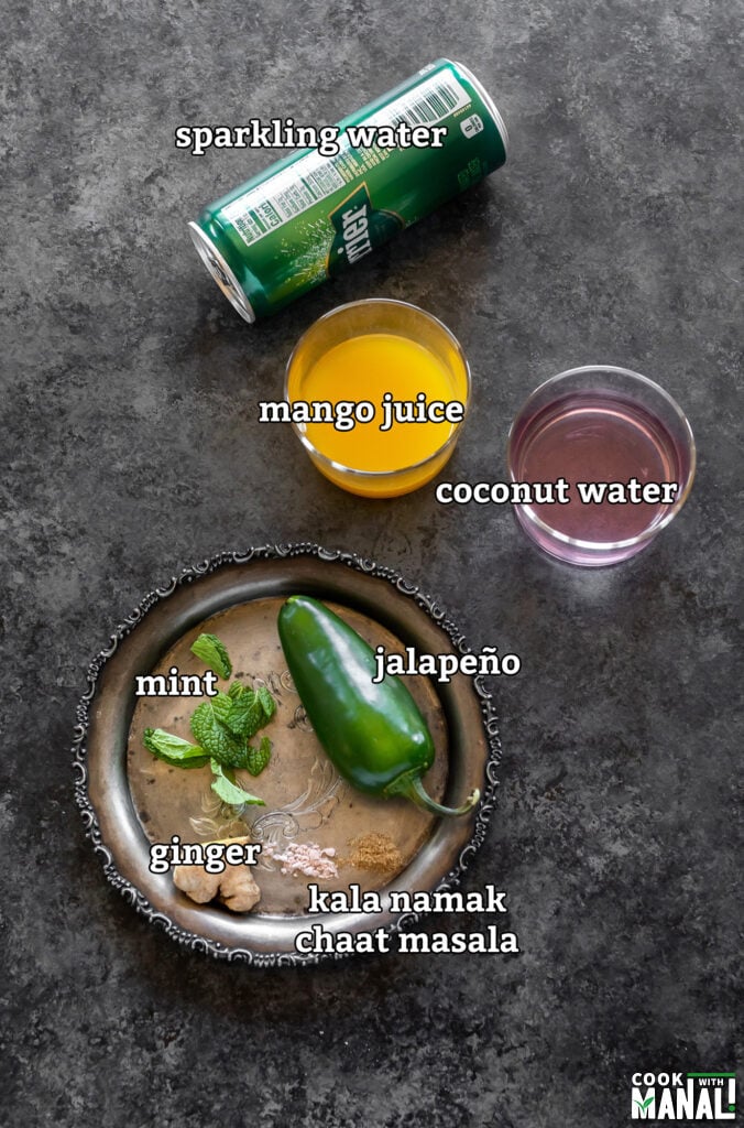ingredients for making mango mocktail arranged on a board
