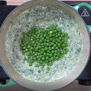 green peas being added to curry
