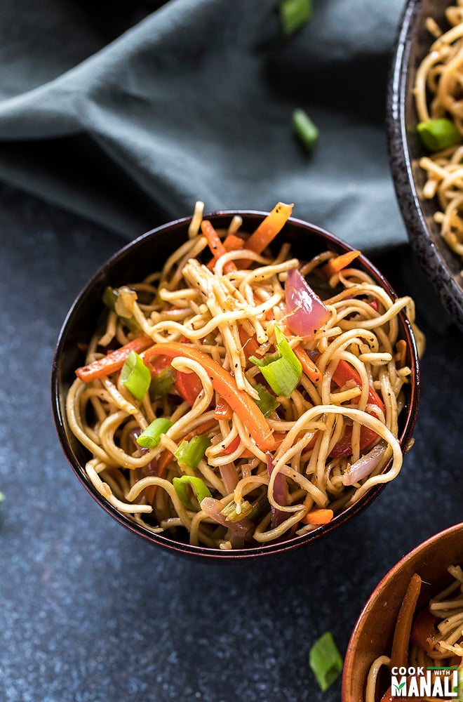 vegetarian hakka noodles in a small wooden bowl