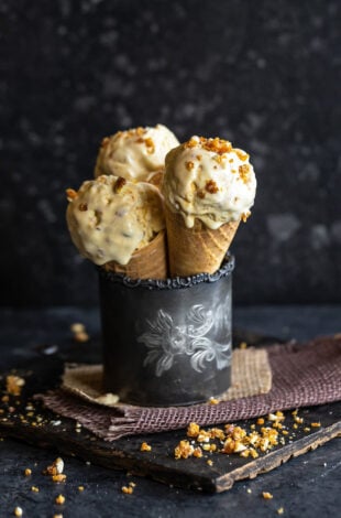 3 cones of ice cream arranged in a metal glass