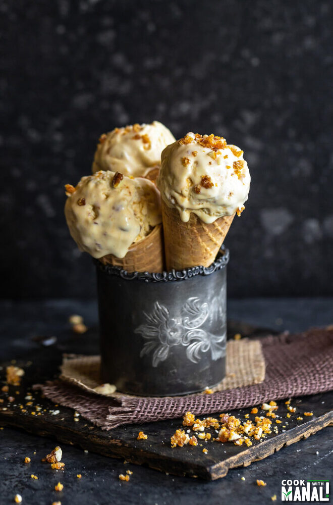 3 cones of ice cream arranged in a metal glass