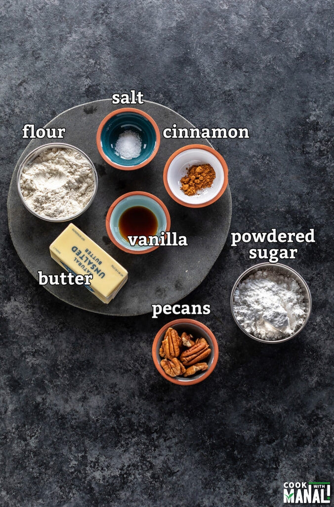 ingredients for brown butter snowball cookies arranged on a board