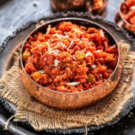 gajar halwa served in a copper bowl