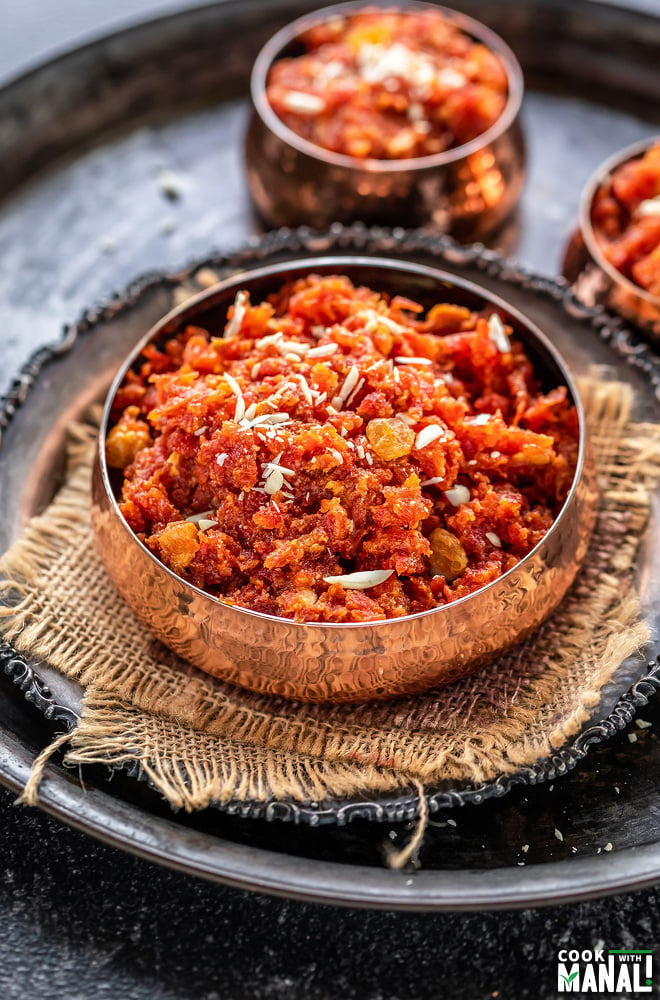 gajar halwa served in a copper bowl