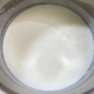milk in a steel pot