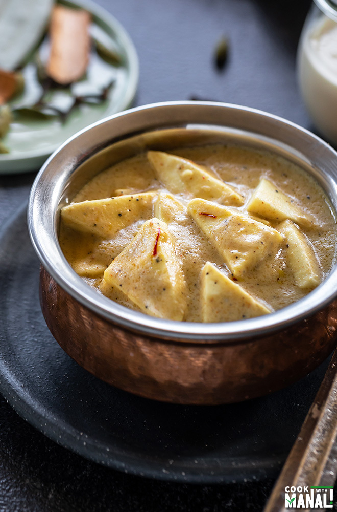 shahi paneer served in a copper bowl