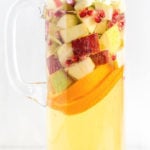 pitcher filled with a bubble drink and lots of fruits