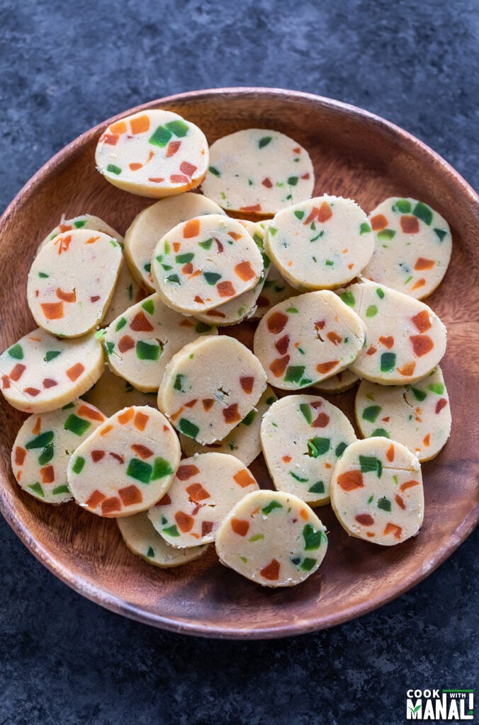 unbaked karachi biscuits arranged in a wooden plate