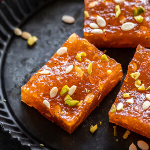 pieces of karachi halwa placed on a black plate