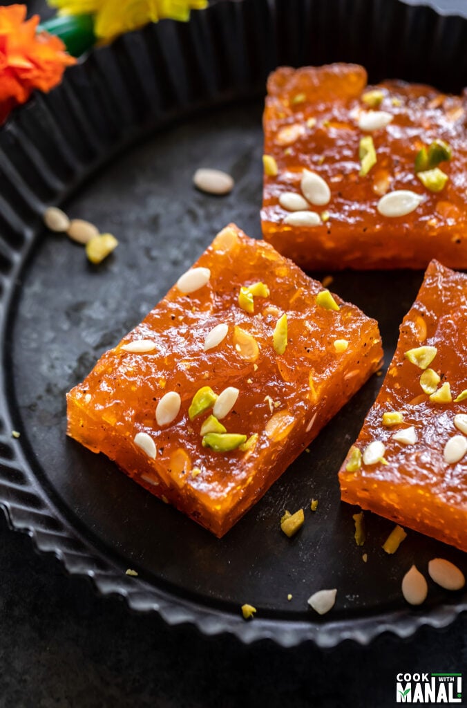 pieces of karachi halwa placed on a black plate