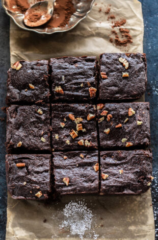 6 large pieces of brownies arranged on a parchment paper