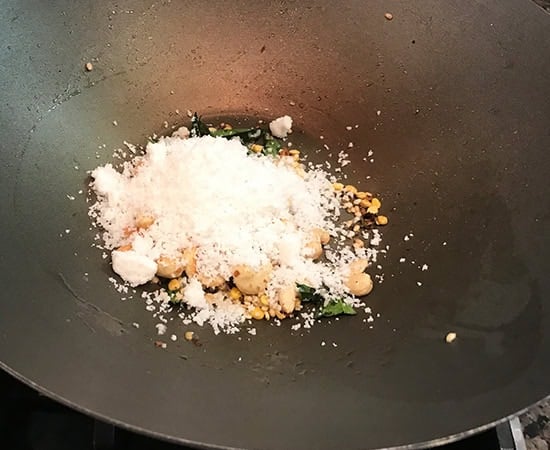 grated coconut added to pan