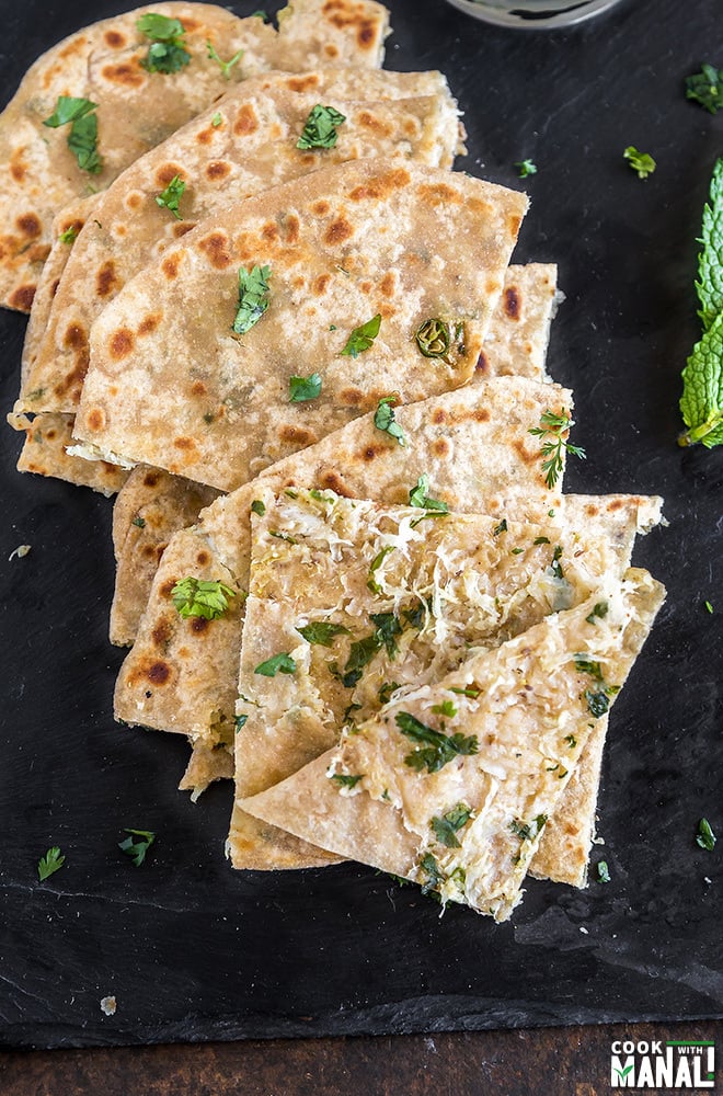 over head shot of mooli paratha which has been cut into small triangles