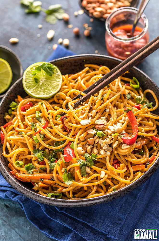 instant pot thai peanut noodles served in a black bowl with chopsticks on the side