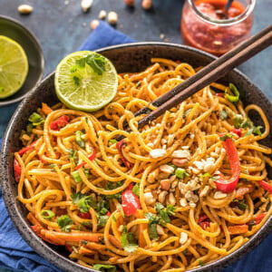 instant pot thai peanut noodles served in a black bowl with chopsticks on the side