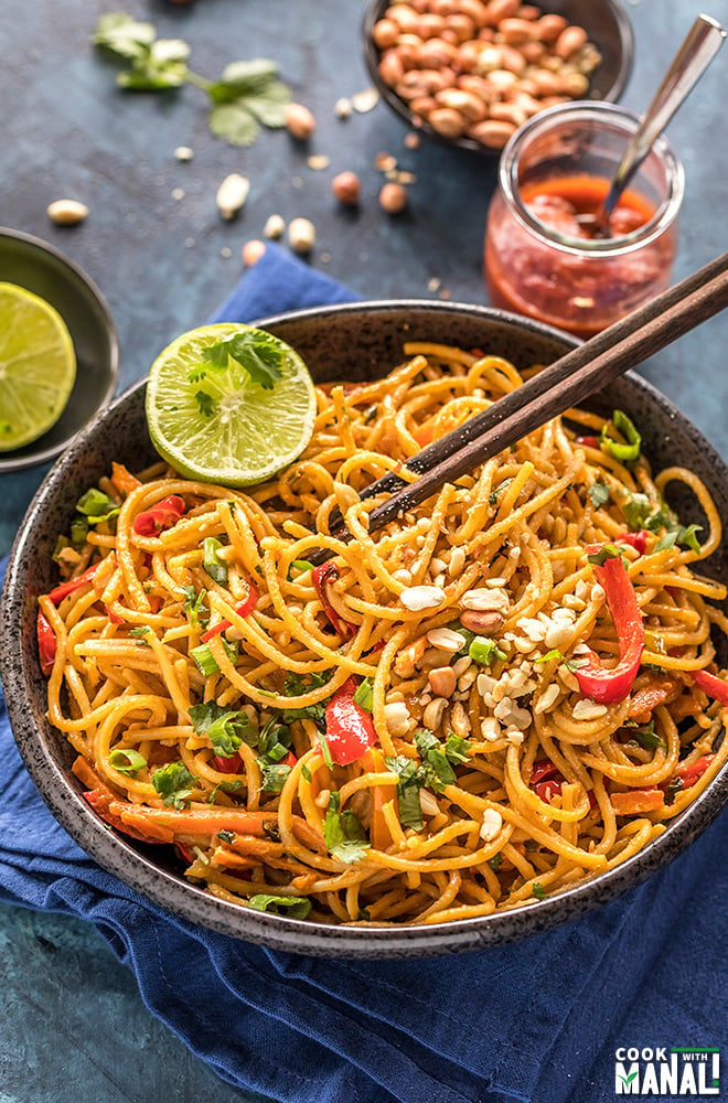 instant pot thai peanut noodles served in a black bowl with chopsticks on the side