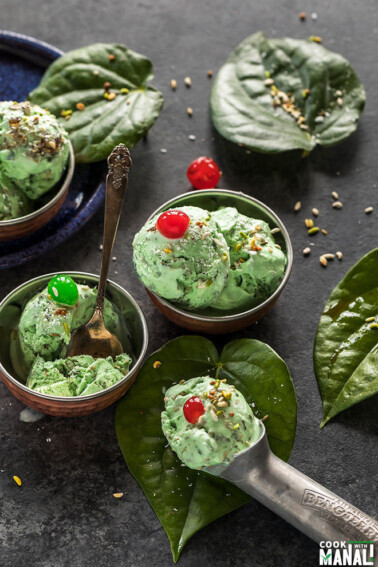 paan ice cream served in small copper bowls and garnished with coconut and cherries