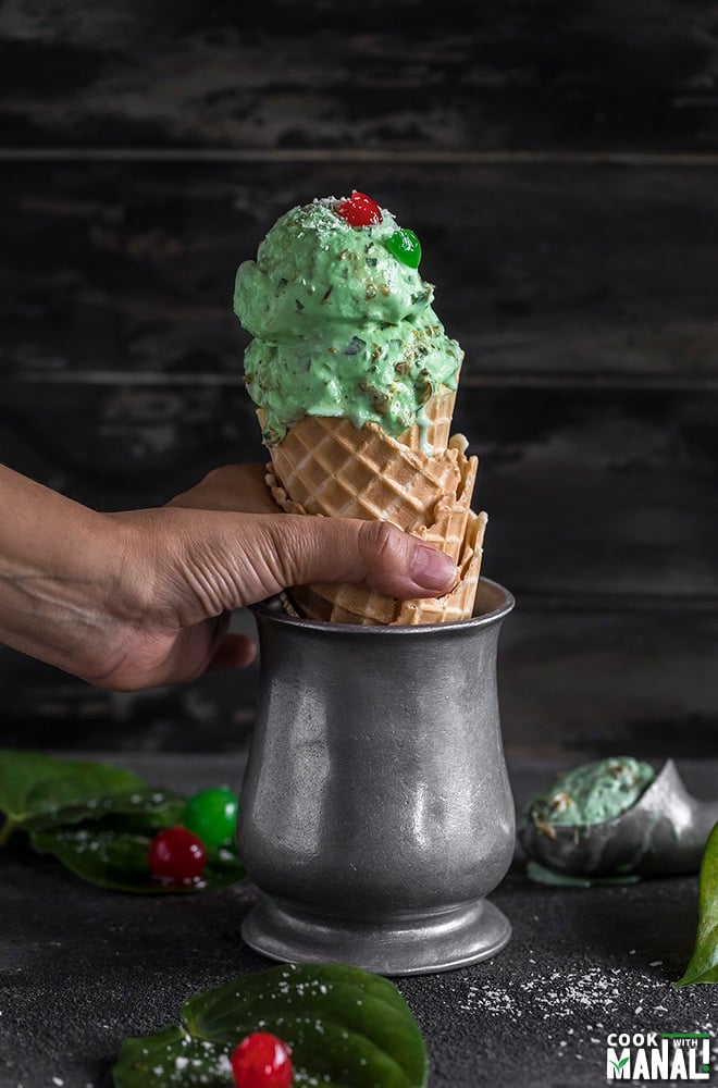 hand holding paan ice cream in a waffle cone