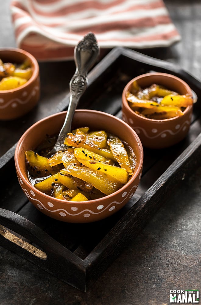 aam ki launji in a bowl with a spoon