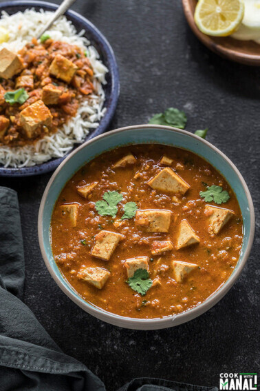 instant pot tofu tikka masala served in a blue bowl and garnished with cilantro