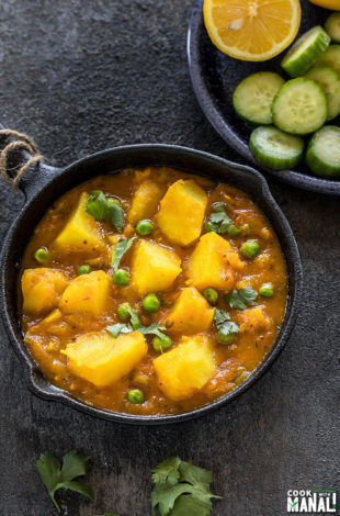 instant pot aloo matar served in a small black skillet