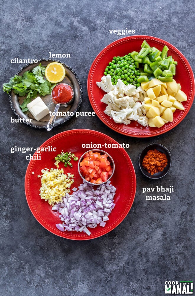 plates with vegetables, chopped onion, tomato, bowls with spices