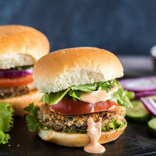 vegetarian burger with lettuce, tomato and a dripping burger sauce