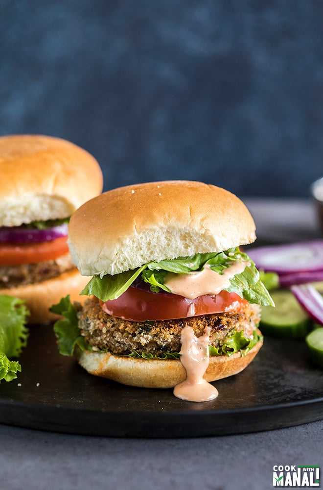 vegetarian burger with lettuce, tomato and a dripping burger sauce