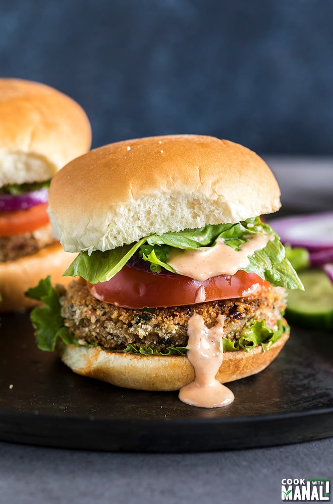 vegetarian burger with lettuce, tomato and a dripping burger sauce