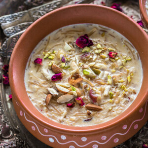 Sheer Khurma served in clay pots in a silver tray