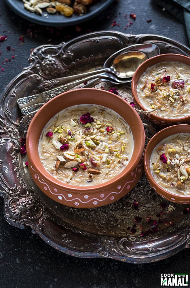 Sheer Khurma served in clay pots in a silver tray