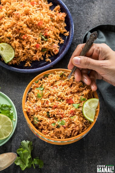 a yellow bowl filled with mexican rice