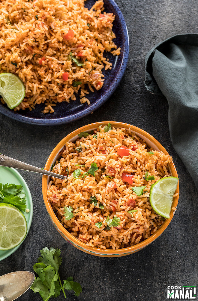 instant pot mexican rice served in a yellow bowl with lime wedge on the side