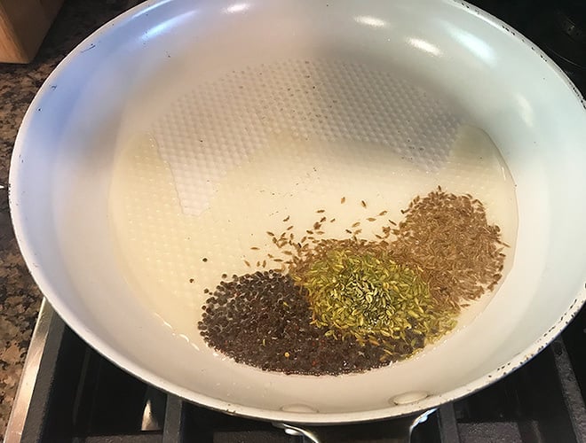 spices frying in a pan