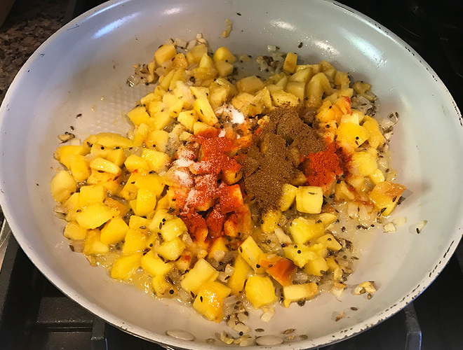 peaches with spices in a pan