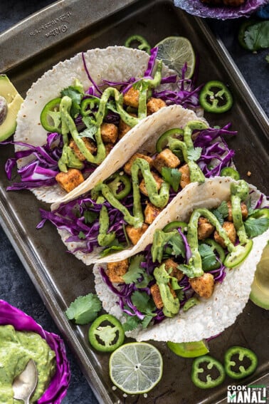 3 crispy tofu tacos topped with avocado lime crema