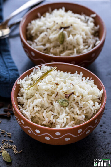 instant pot jeera rice served in a clay bowl