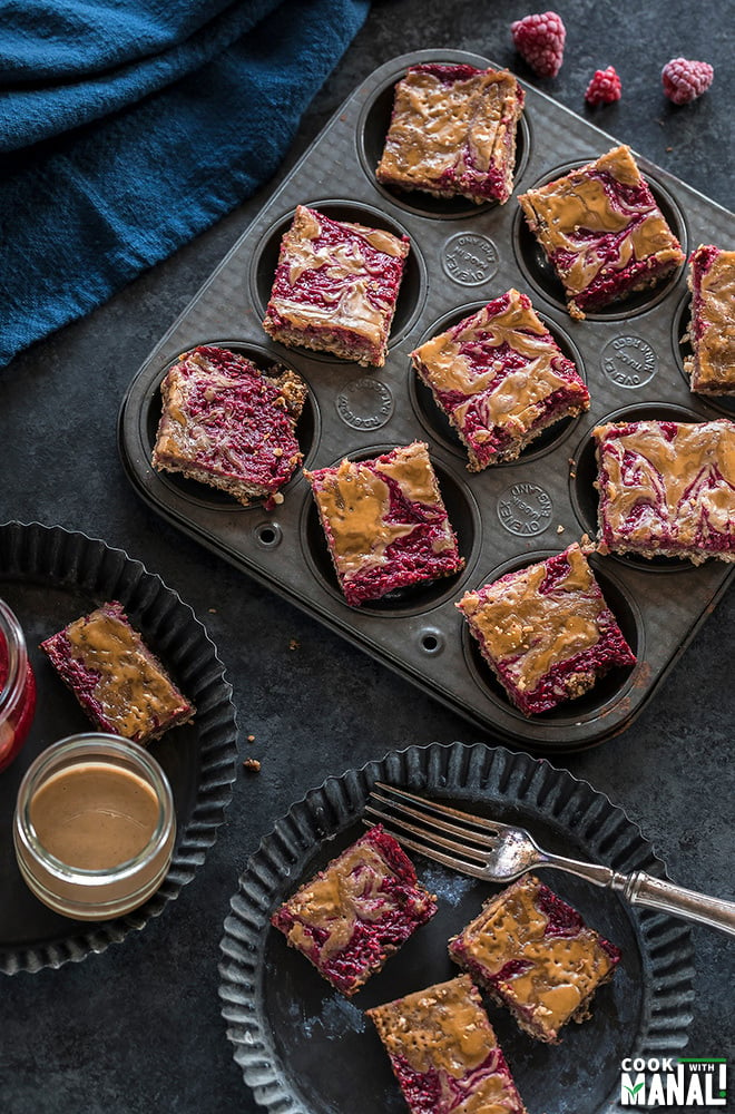 vegan peanut butter & jelly bars placed in a muffin tin