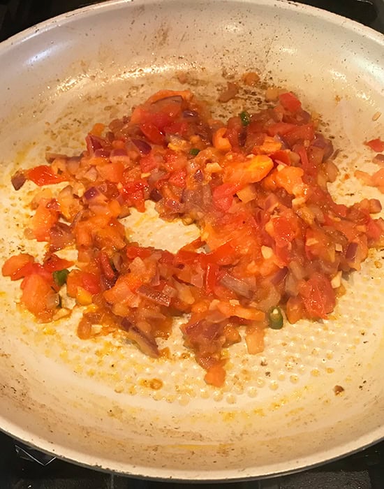 cooked onion tomato masala in a pan