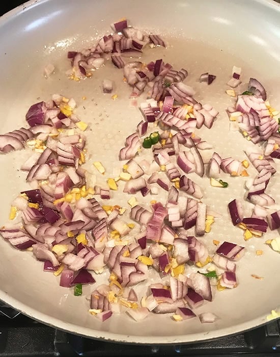 chopped onion with ginger garlic in a pan