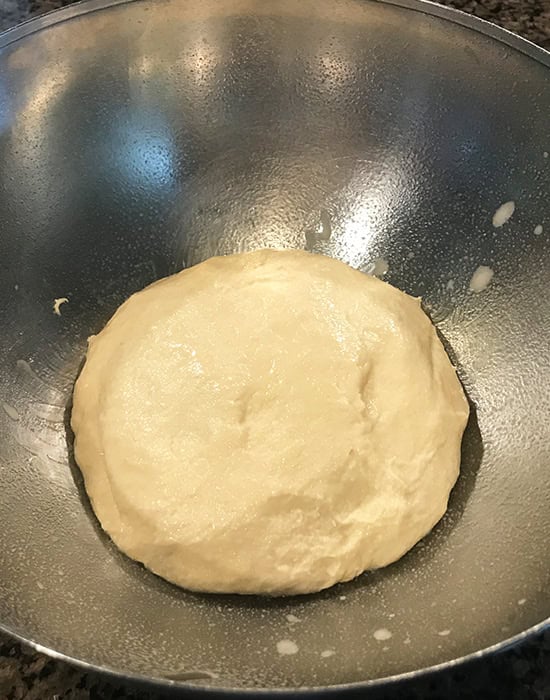 dough placed in a steel bowl