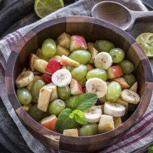 Indian fruit chaat in a wooden bowl