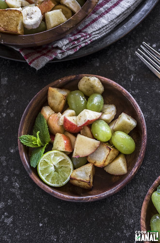 fruit chaat in a small wooden plate