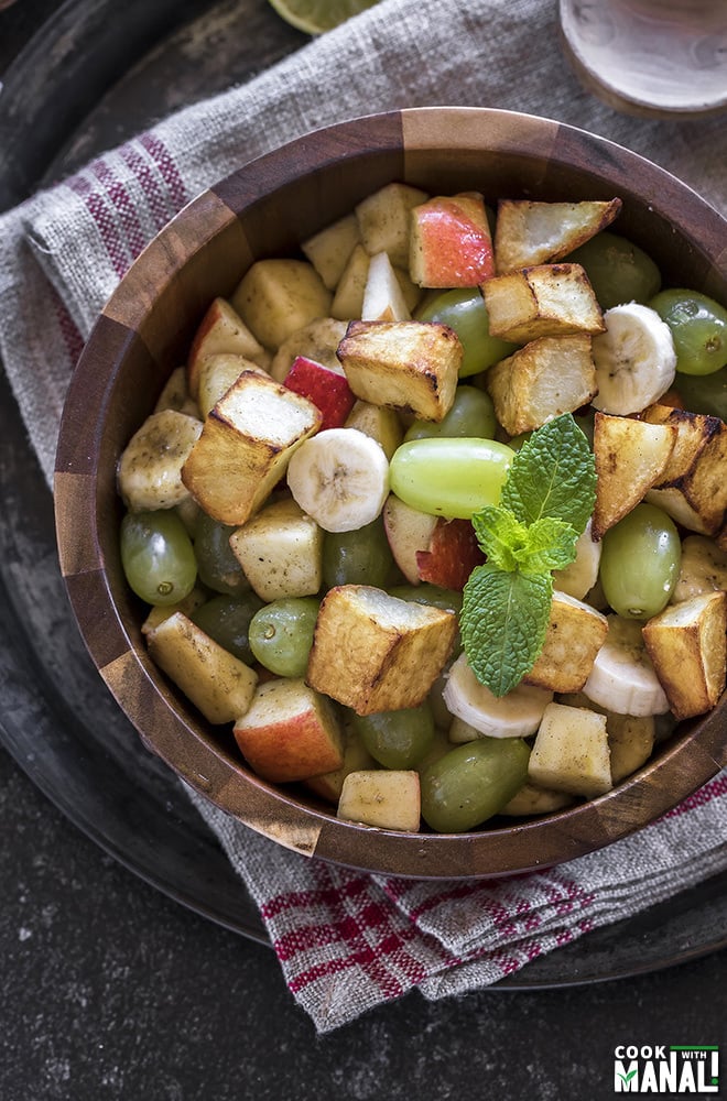 fruit chaat served in a wooden bowl