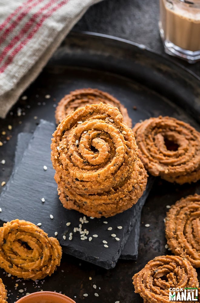 stack of homemade chakli on a black plate