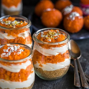 jars of motichoor cheesecake ladoo with spoon on the side and motichoor ladoo in the background