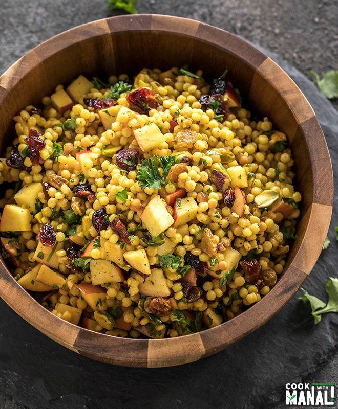 israeli couscous salad in a wooden salad bowl