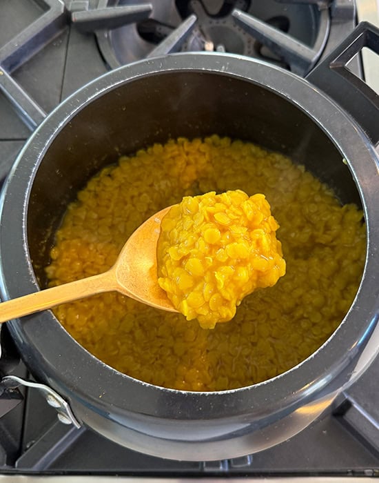 spatula showing soft mashed dal
