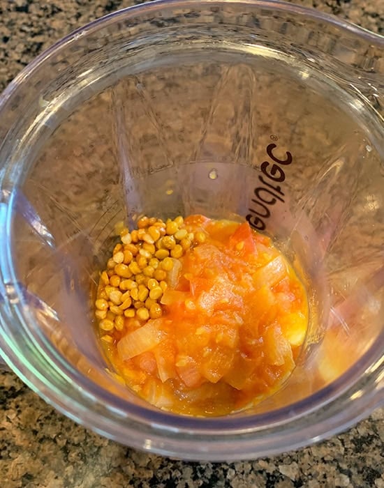 chana dal with onion tomatoes in a blender